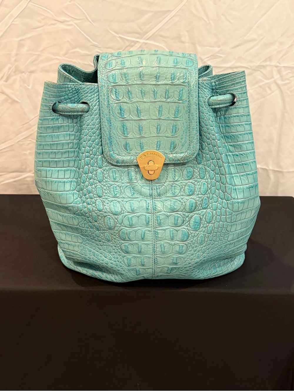 Brahmin Turquoise  very good condition sling backpack. Faux Alligator.